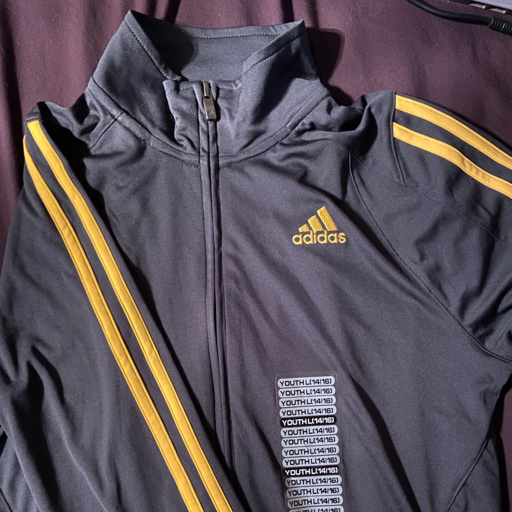Grey & Yellow ADIDAS zip up. Size LARGE IN YOUTH